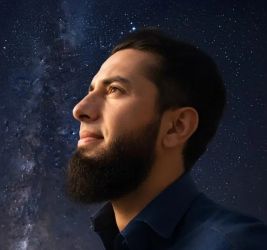 Portrait of Naqqash Khan, founder of NEO Business Solutions, looking up at the night sky
